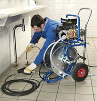 Chandler drain cleaning expert using a pressure jetter