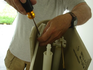 Chandler AZ plumbing technician attaches a float valve